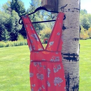 ASOS orange romper with purple flower detail and tie back, low v neck size 4